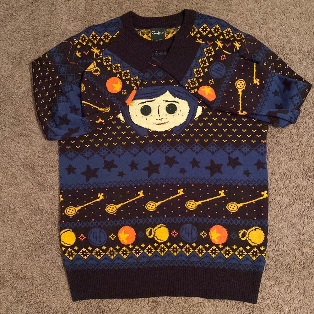 A multi color LIMITED EDITION Coraline ugly sweater from Hot Topic